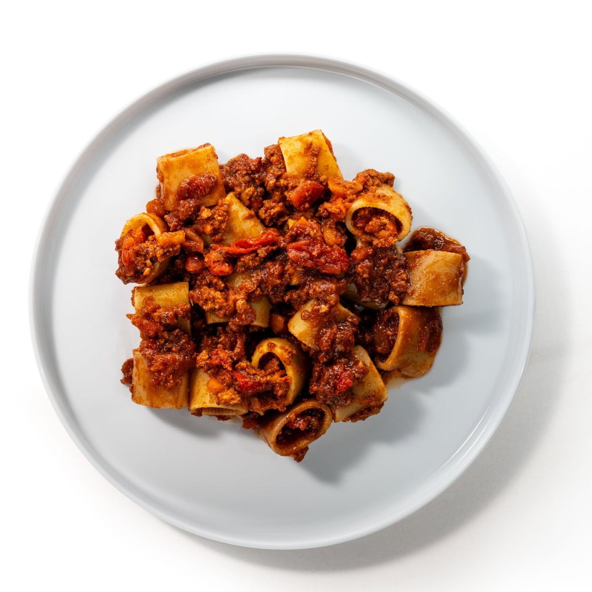 Plate of short tube pasta with Bolognese Salsiccia, seen from above
